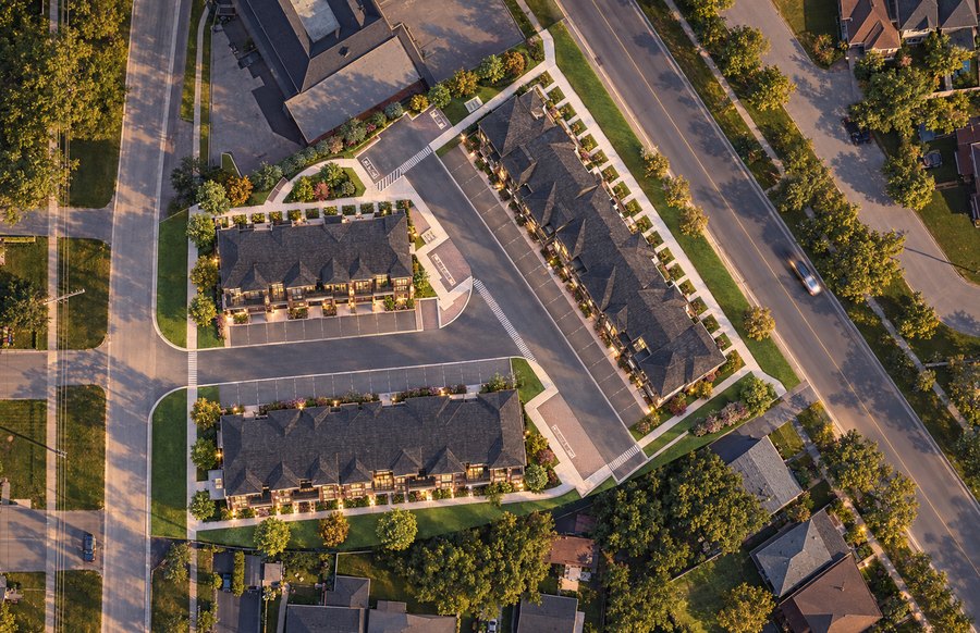 Overhead view of the three townhome blocks, driveways and landscaping at 1188 Simcoe Street South